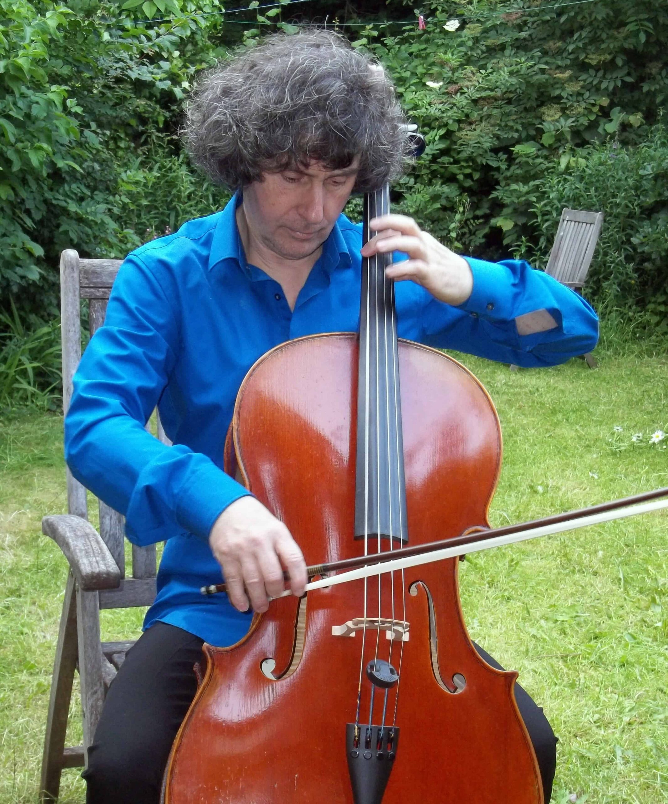 Robin Stevens playing the cello outside